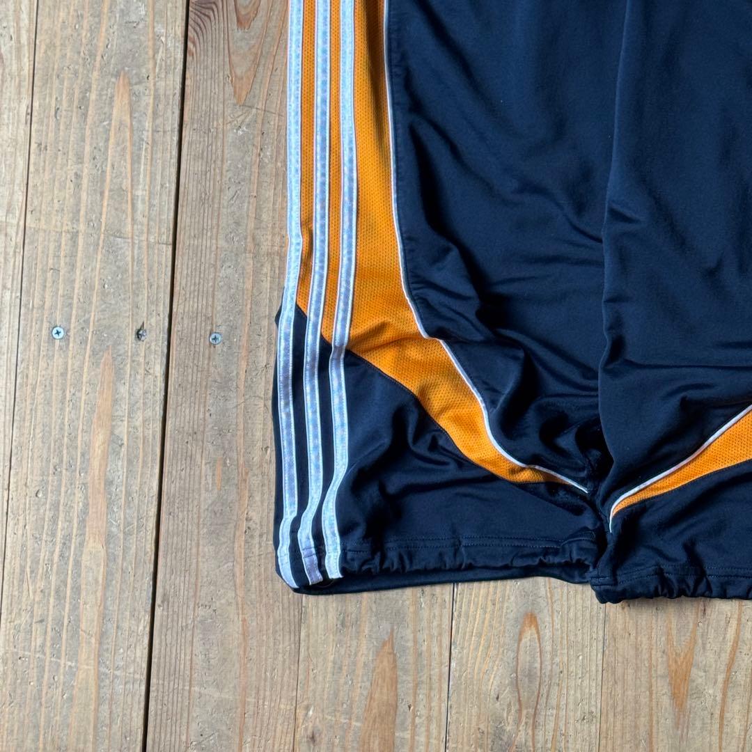 adidas ストライプジャージパンツ ブラック/オレンジ